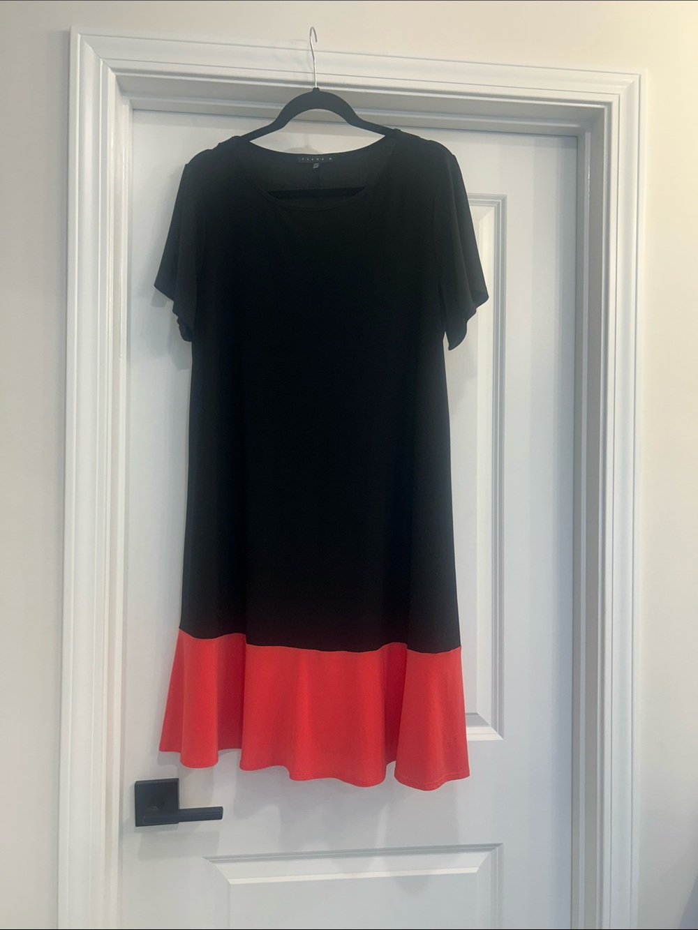 Tiana B. Black Dress with coral colored Hem
